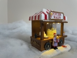 Weihnachtsdorf/-szene:  Popcornautomat mit LED Beleuchtung, bewegenden Popcorns, batteriebetrieben