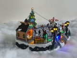 Christmas village/scene: ice skating rink with LED lighting, music and moving ice skaters, including power adapter; available from 15.10.2022